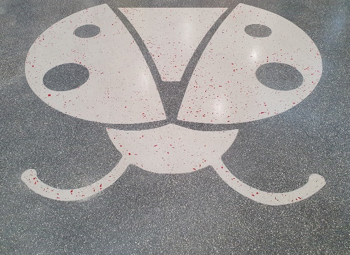 Ladybug pattern on terrazzo flooring